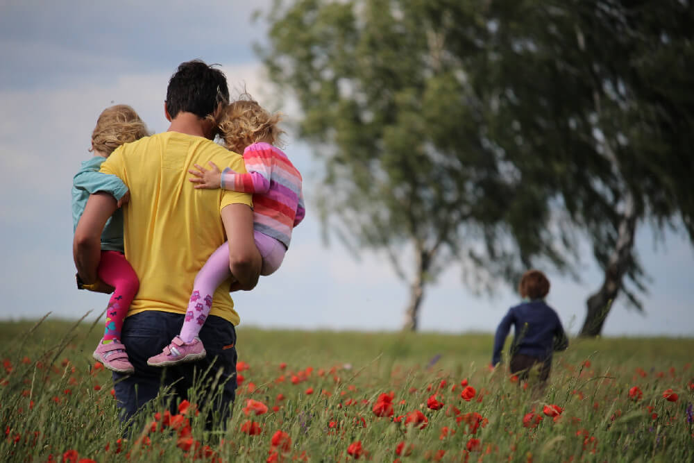 A family walking together in a field